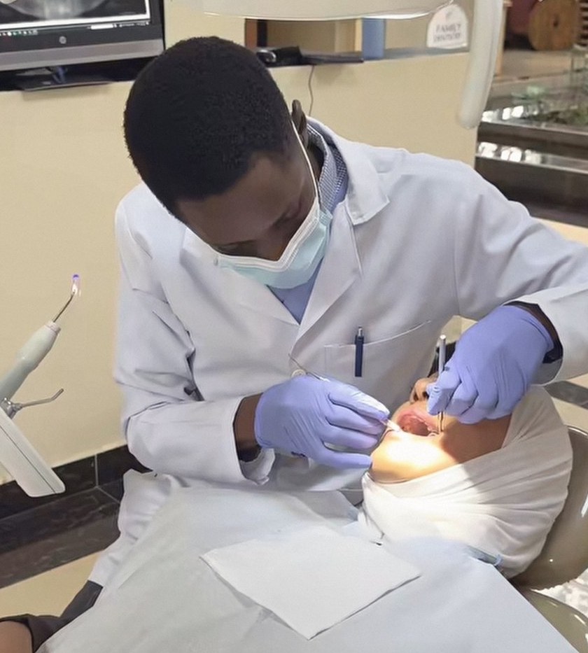 A Family Dentistry Nairobi dentist examining a patient in the chair